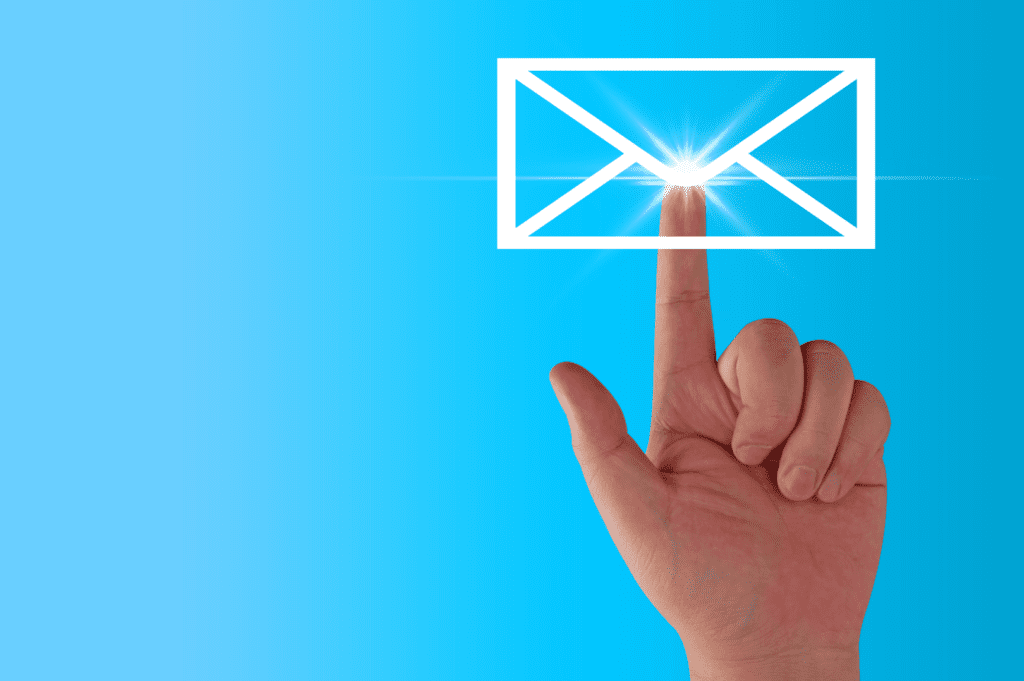 A human finger clicking an envelope representing an email